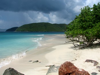 Rocks and sand along Cinnamon Bay